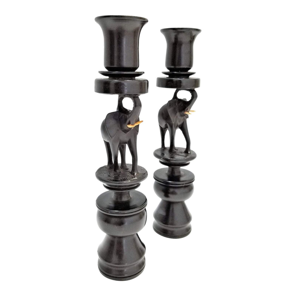 A pair of Elephant Curved Ebony Candle Holders